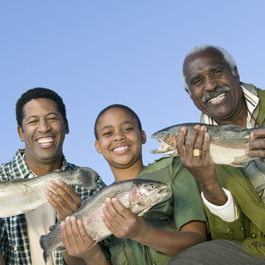 Family Holding Fish